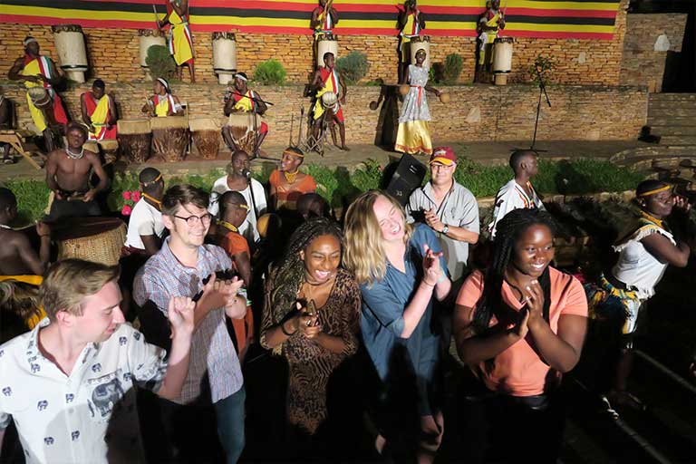 Students attend a traditional African event.