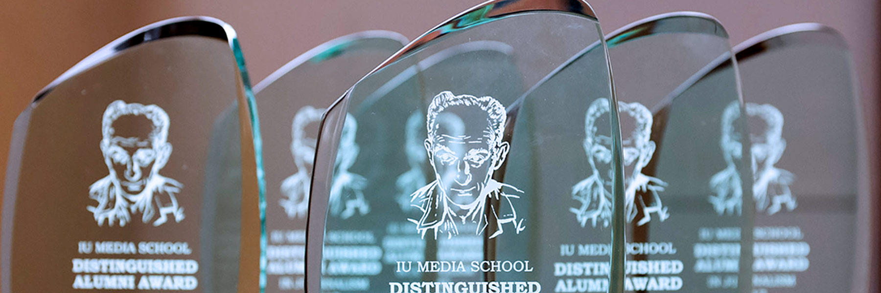Six Distinguished Alumni Award engraved glass plaques