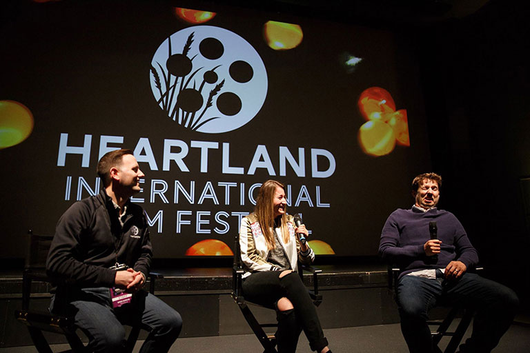 Greg Sorvig, BA'06, leads a post-screening Q&A after the 2018 Heartland International Film Festival screening of 'When Jeff Tried to Save the World' with director Kendall Goldberg and actor Jon Heder.