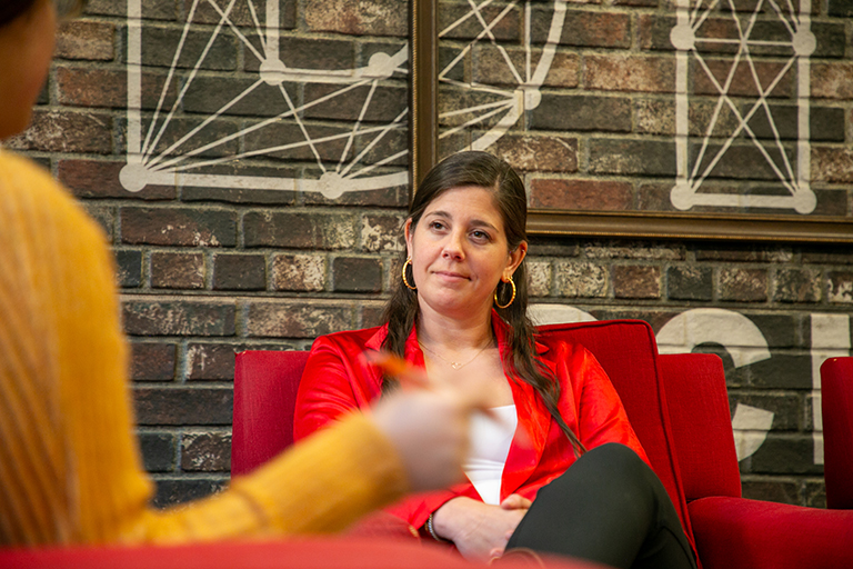 Stephanie Kuzdym listens to an interviewer.