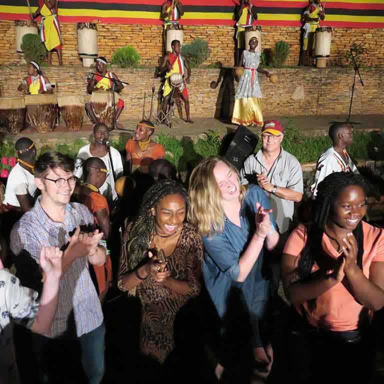 A group of students attend a traditional African event.