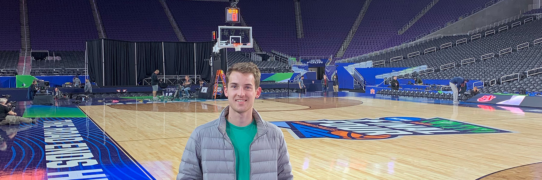 Ben Ladner on the basketball court at the 2019 men's Final Four.
